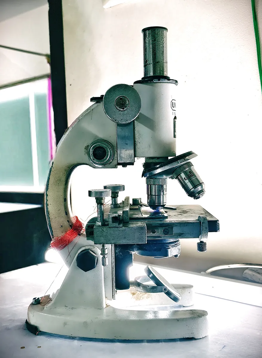 A laboratory optical microscope on a bench